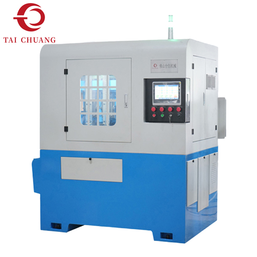 Machine à tarauder les écrous automatique