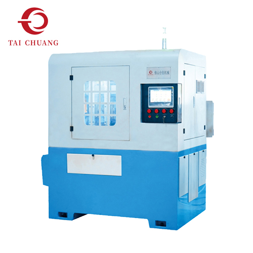 Machine à tarauder les écrous servo